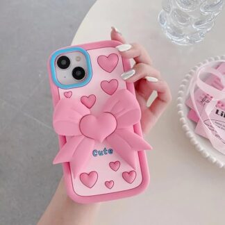 a hand holding a pink phone case